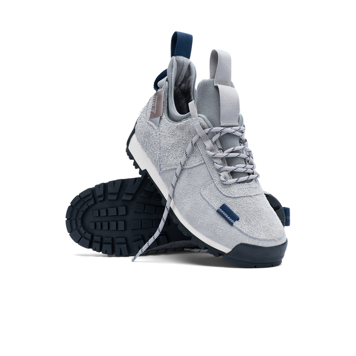 stylized view  / Approach / Lunar color features Light Grey colored hairy suede upper, gross grain webbing for laces. helastic heel detail, stretch mesh internal bootie, vintrage vibram hiking outsole and eva midsole.