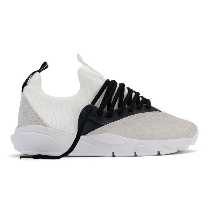 Profile view, Cloudstryk Fairbanks is a runner with White suede overlays white stretch mesh underlays, Black heel pull molded lace holder, white eva midsol and white rubber outsole.