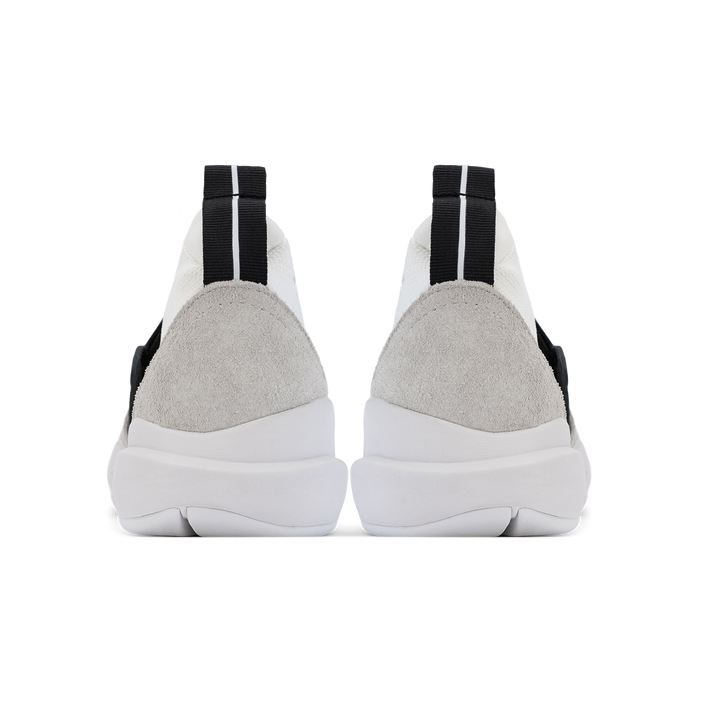 Back view, Cloudstryk Fairbanks is a runner with White suede overlays white stretch mesh underlays, Black heel pull molded lace holder, white eva midsol and white rubber outsole.
