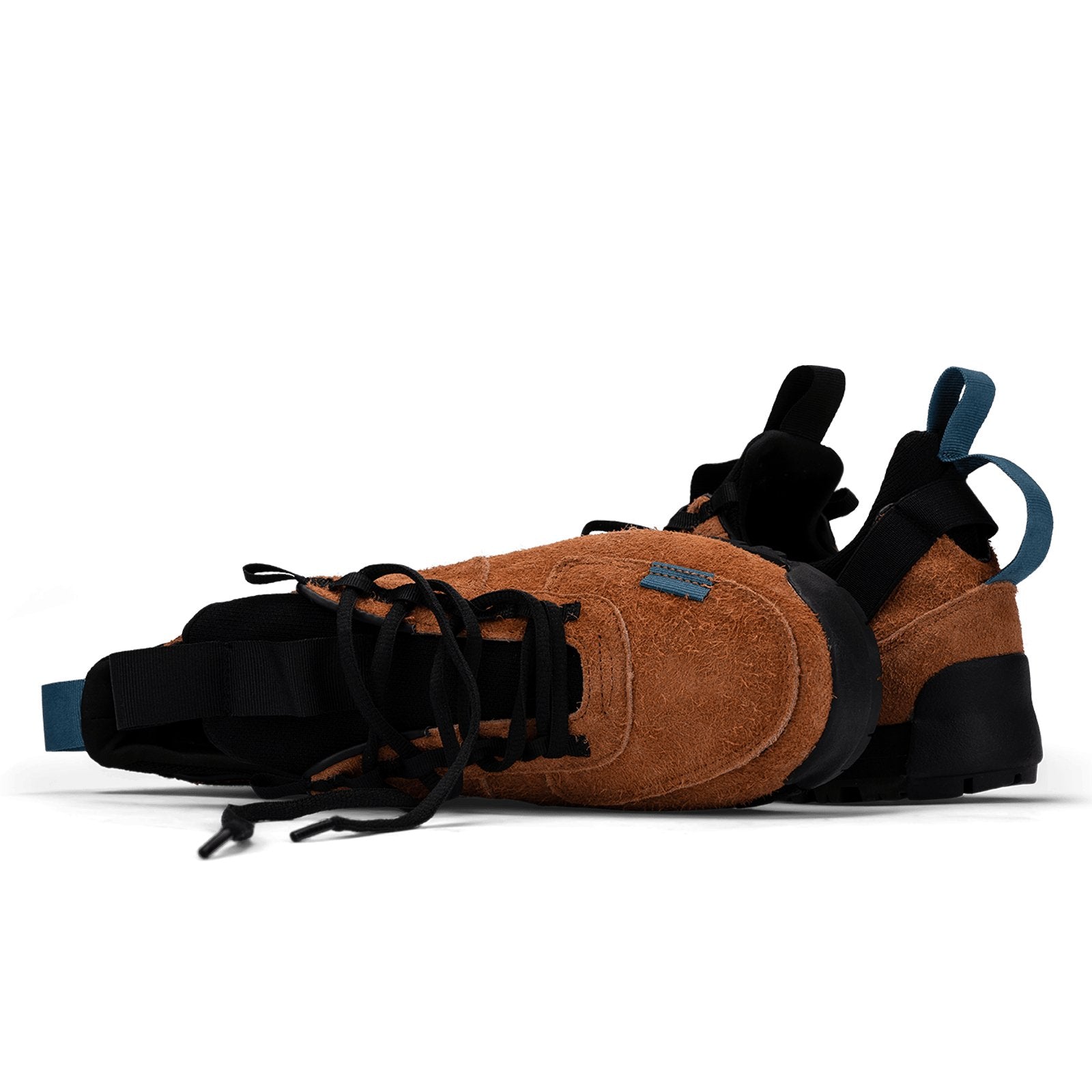 stylized shot  / Approach / Auburn color features tabaco colored hairy suede upper, gross grain webbing for laces. helastic heel detail, stretch mesh internal bootie, vintrage vibram hiking outsole and eva midsole. 