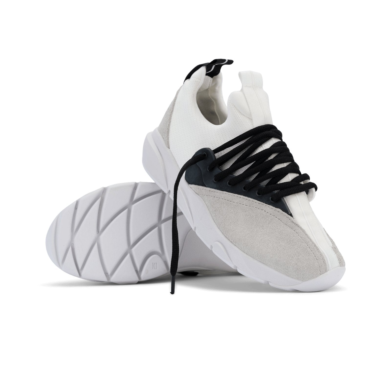 Stylized shot, Cloudstryk Fairbanks is a runner with White suede overlays white stretch mesh underlays, Black heel pull molded lace holder, white eva midsol and white rubber outsole.