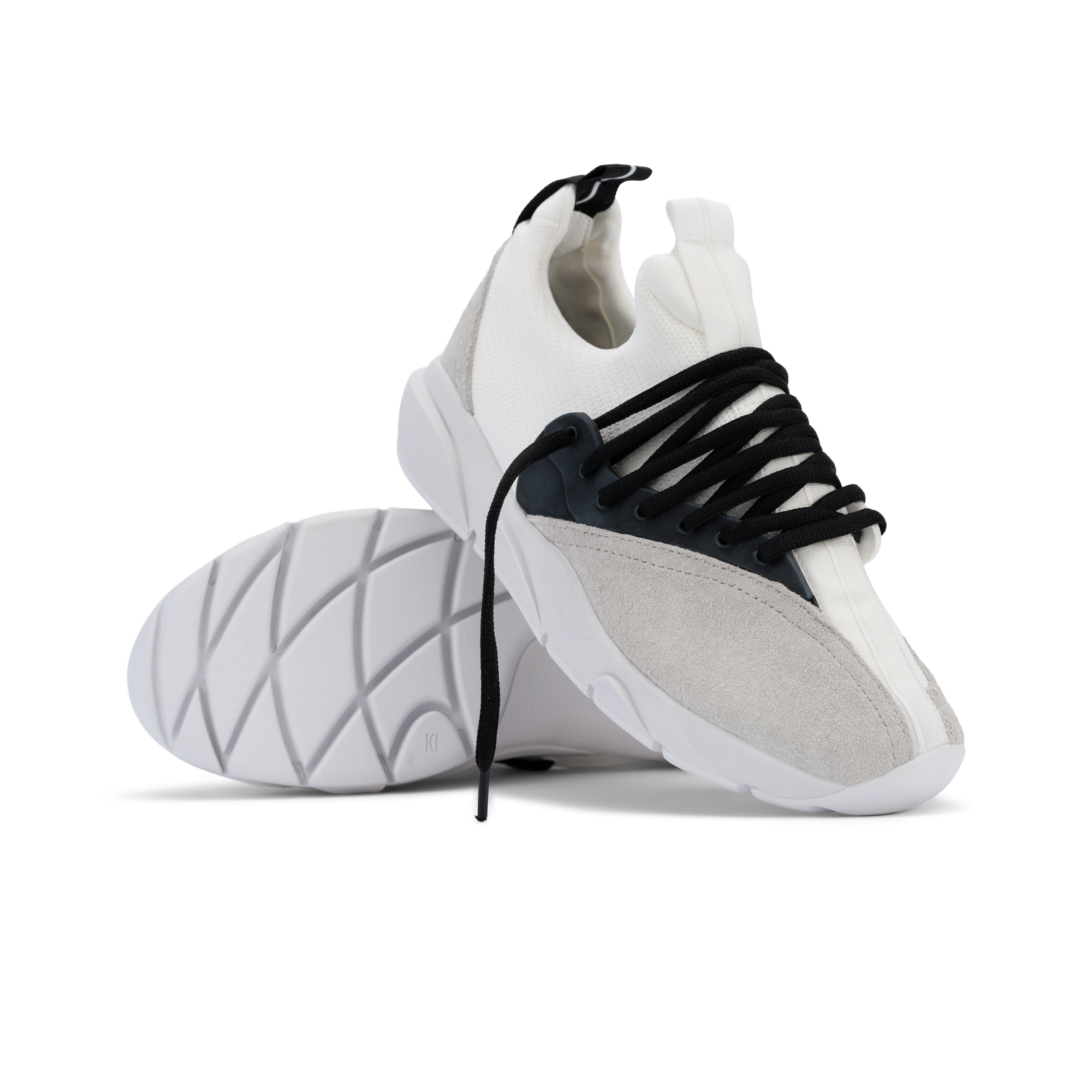 Stylized shot, Cloudstryk Fairbanks is a runner with White suede overlays white stretch mesh underlays, Black heel pull molded lace holder, white eva midsol and white rubber outsole.