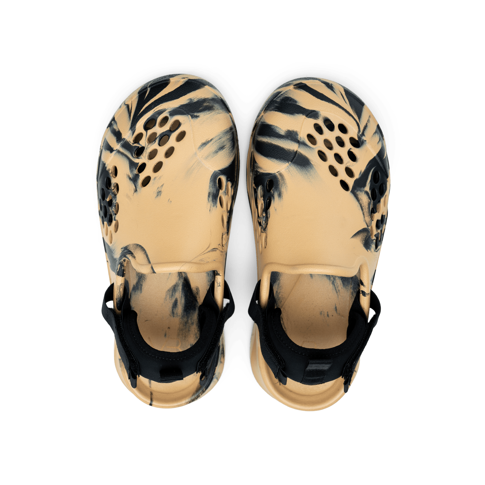Pair of tan sandals with black abstract pattern on a white background