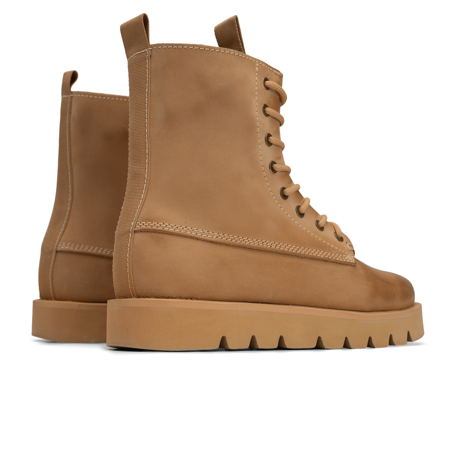 Pair of brown leather boots on a white background