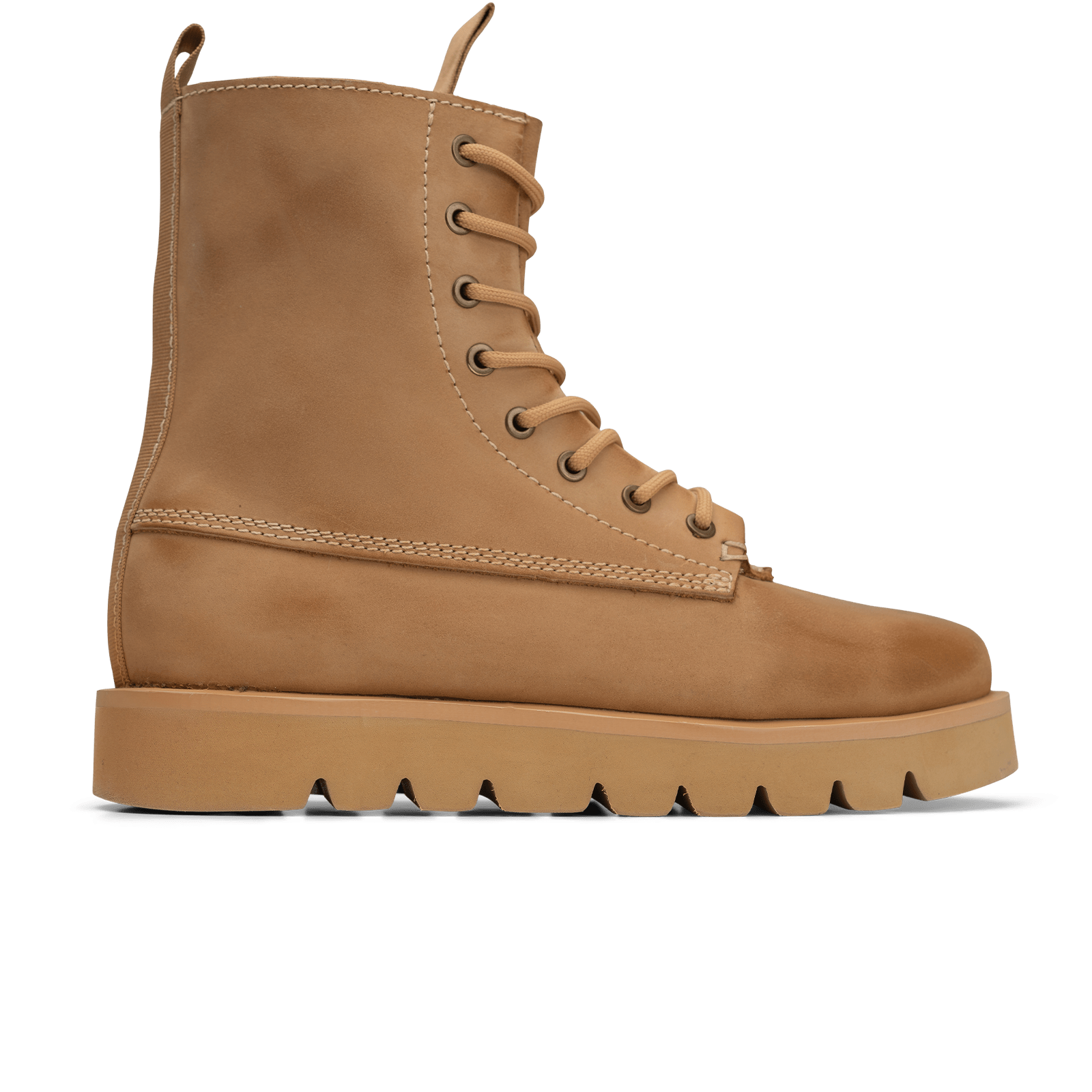 Tan boot with a thick sole on a white background