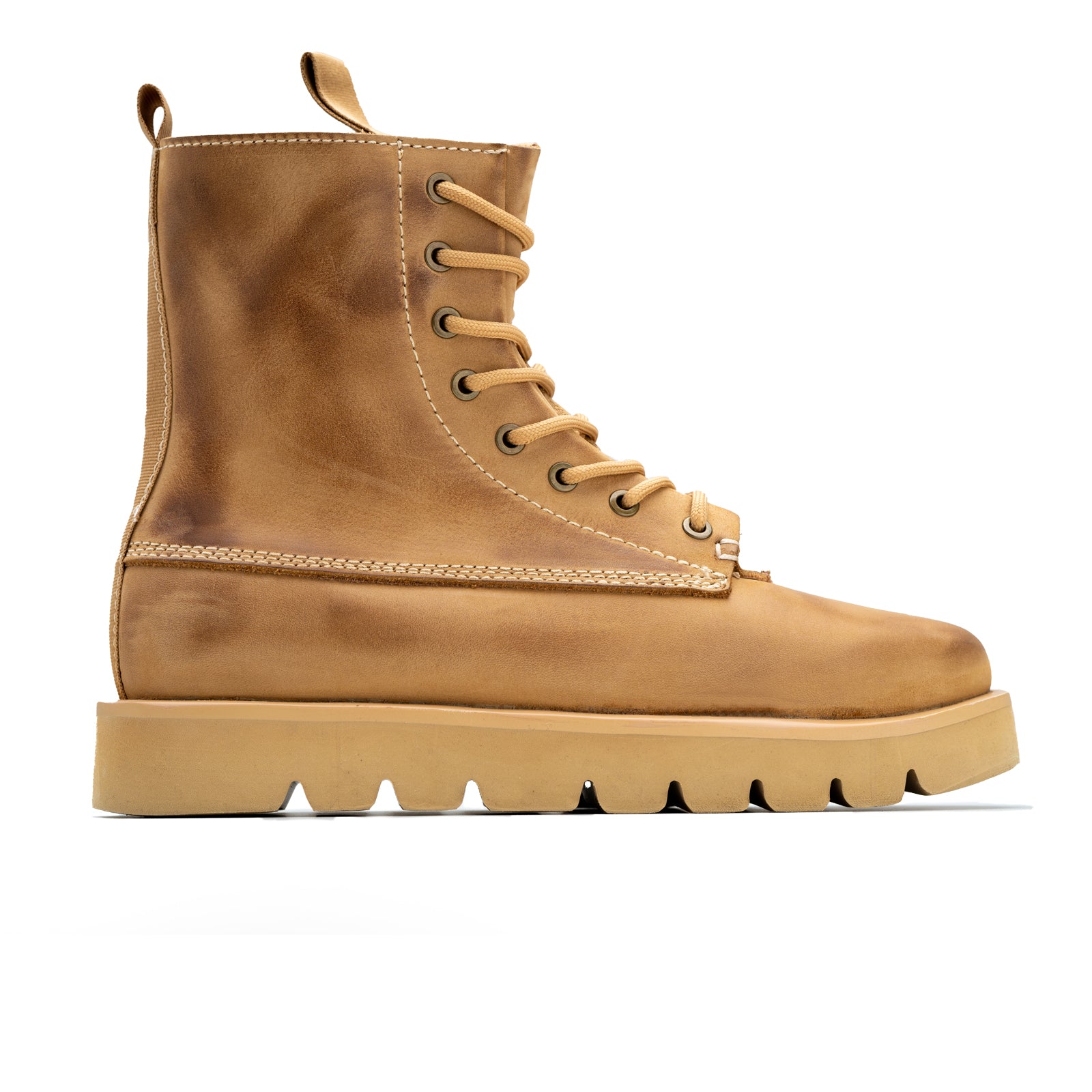 Brown leather boot with a white background