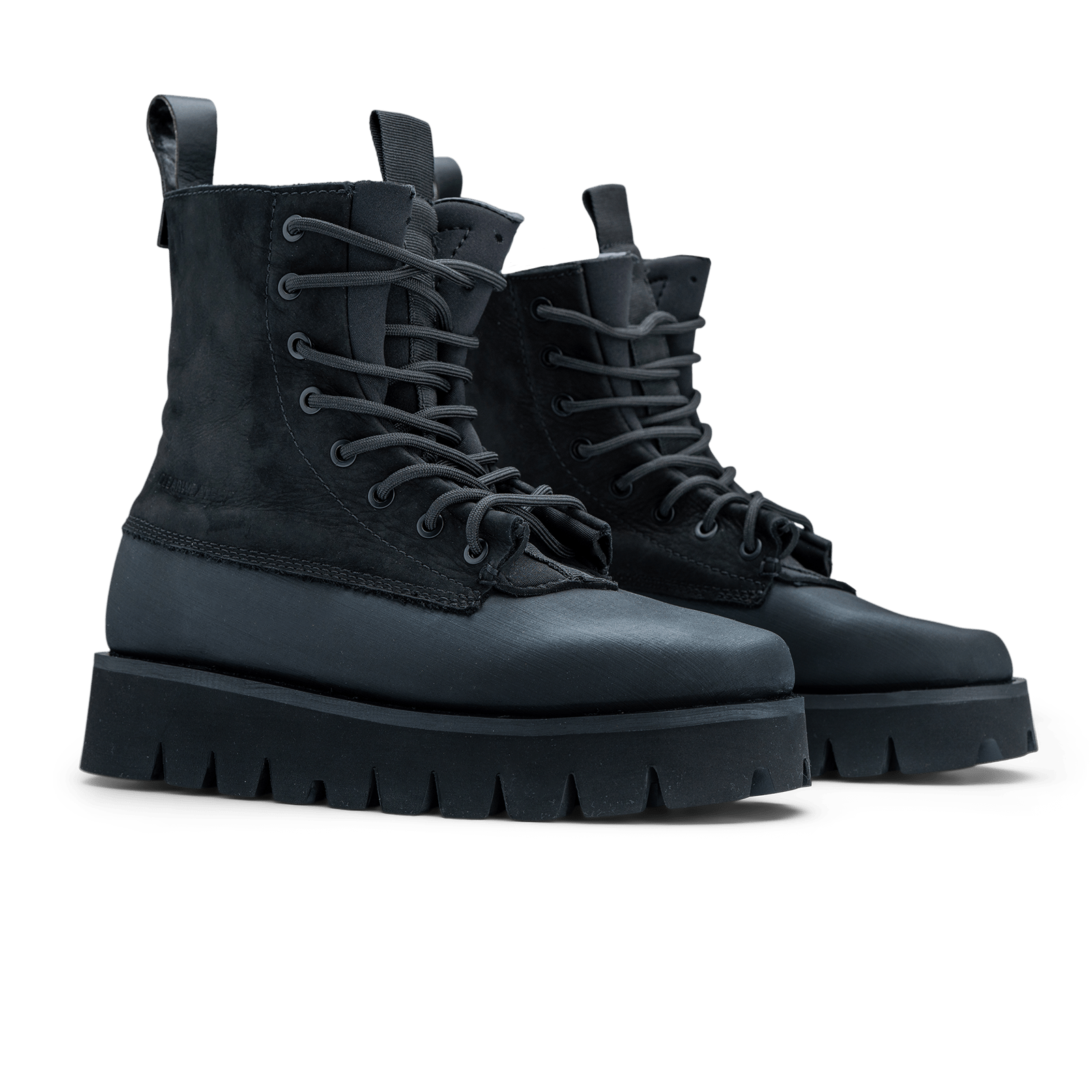 Pair of black lace-up boots on a white background