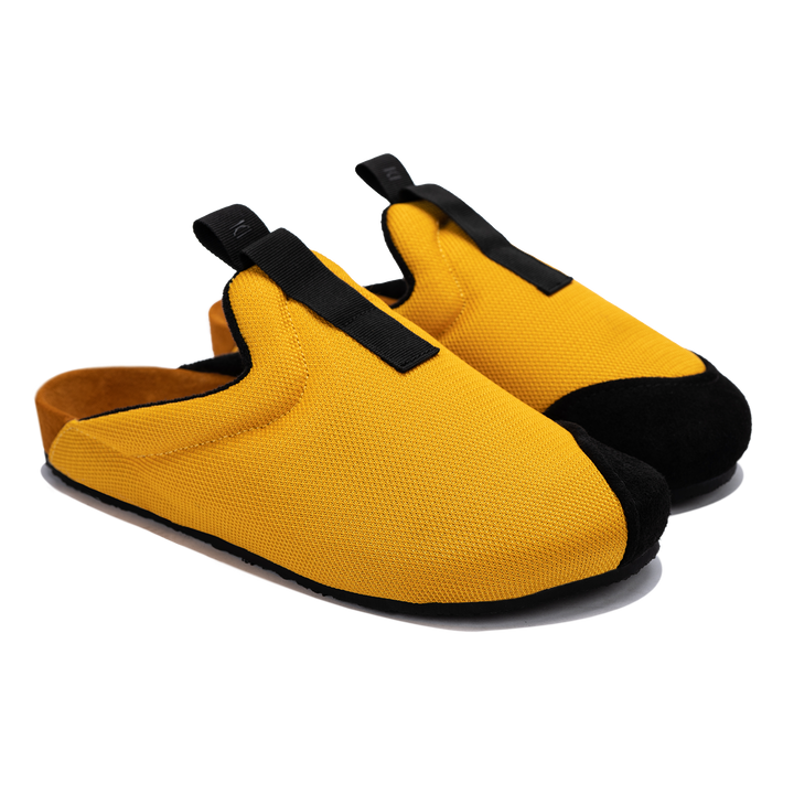 Other 3/4 view Bantha 2.0 Yellow is a Mule made of Yellow mesh with a Black hairy suede to overlay, cork midsole with suede top lining Black VIbram rubber bottom and woven top pull
