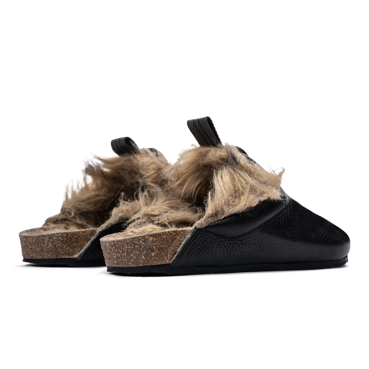 Back 3/4 view  Bantha Himalya is a Mule with faux fur lining. - Black tumbled leather upper and vibram sheet rubber bottom.