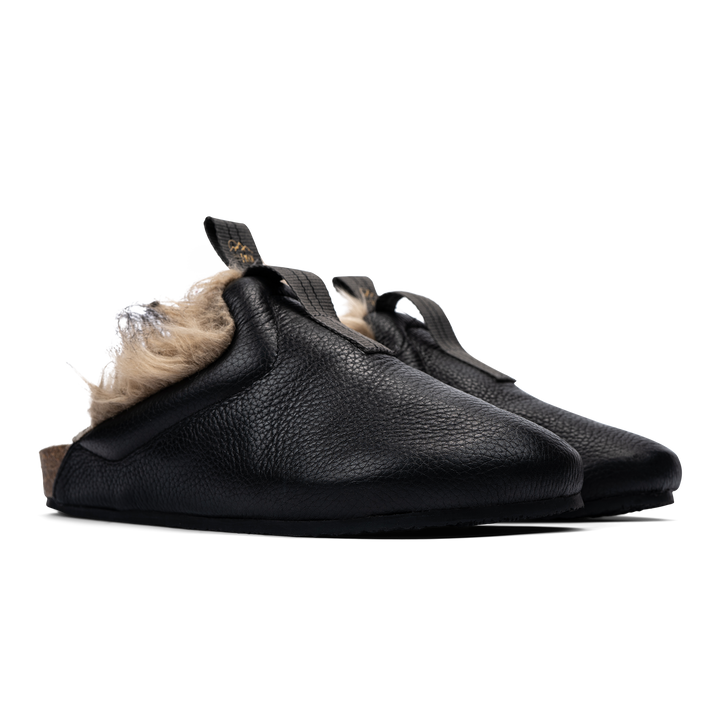 3/4 view  Bantha Himalya is a Mule with faux fur lining. - Black tumbled leather upper and vibram sheet rubber bottom.