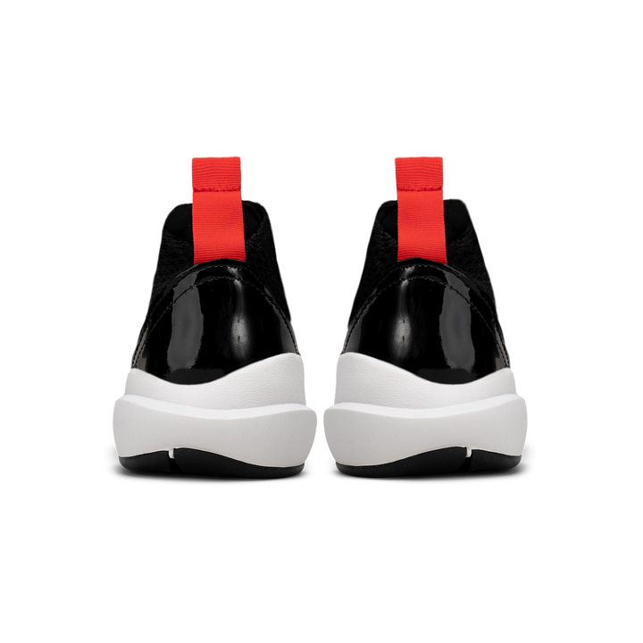 Backview, Cloudstryk Advantage is a runner with Black patent leather and suede overlays zoom mesh underlays, red heel pull molded lace holder, white eva midsol and a translucent black rubber outsole.