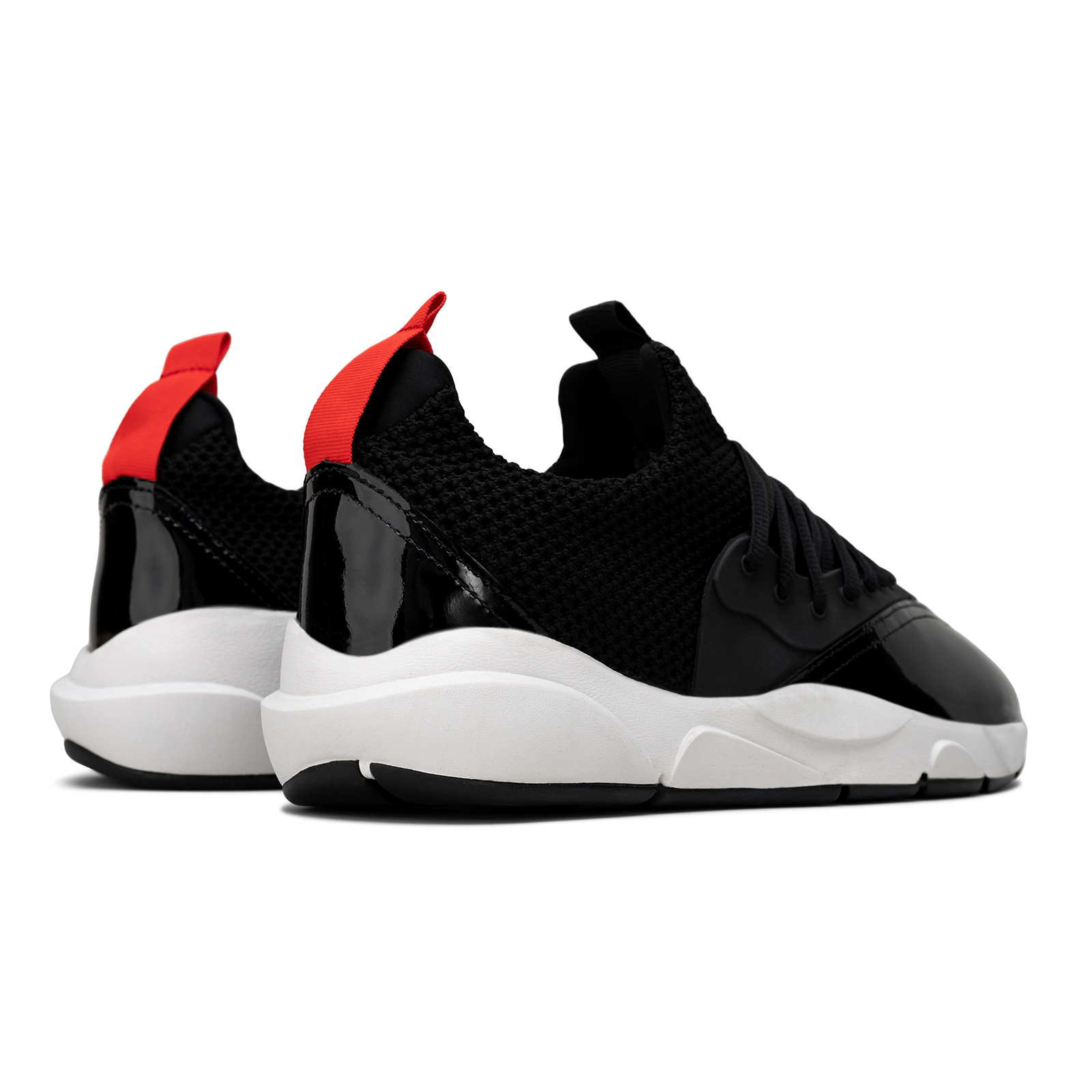 Back 3/4 view, Cloudstryk Advantage is a runner with Black patent leather and suede overlays zoom mesh underlays, red heel pull molded lace holder, white eva midsol and a translucent black rubber outsole.