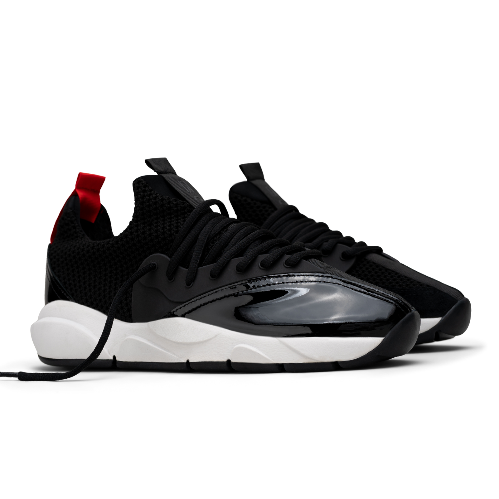 3/4 view, Cloudstryk Advantage is a runner with Black patent leather and suede overlays zoom mesh underlays, red heel pull molded lace holder, white eva midsol and a translucent black rubber outsole.