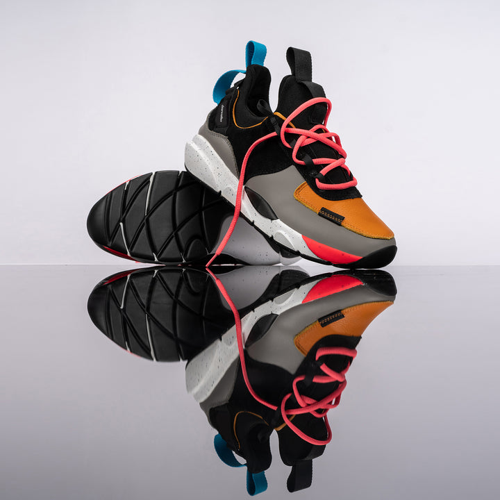 Stylized shots, The Contera Kalahari is a Runner with grey leather black suede and tabaco orange leather, Blue webbing heel pull, Black webbin tongue pull, Black webbing lace system, painted eva midsole ande black rubber outsole.