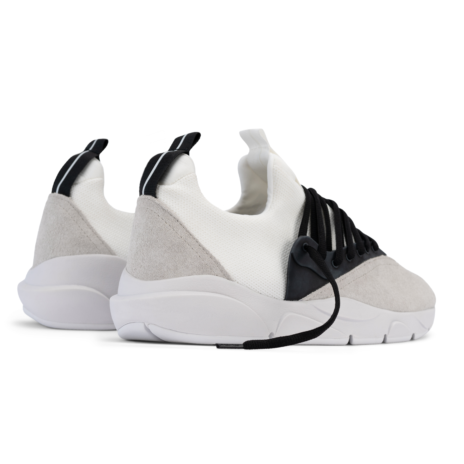 Back 3/4 view, Cloudstryk Fairbanks is a runner with White suede overlays white stretch mesh underlays, Black heel pull molded lace holder, white eva midsol and white rubber outsole.